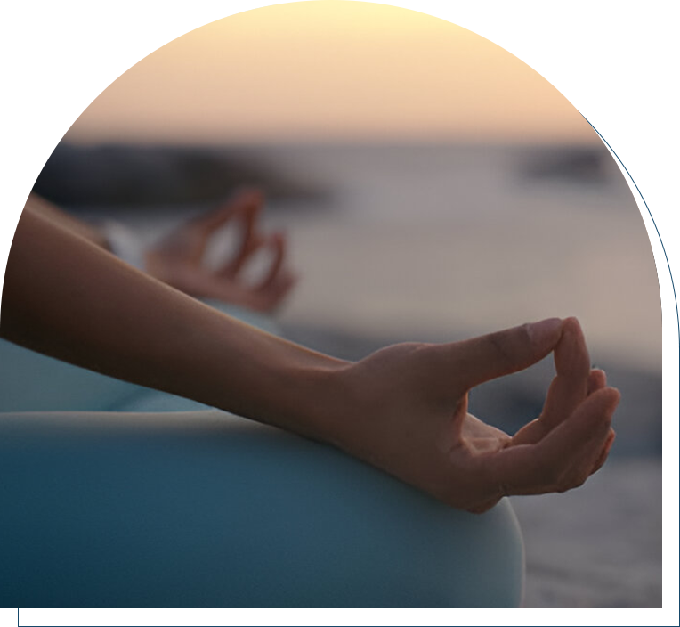 A person is doing yoga on the beach